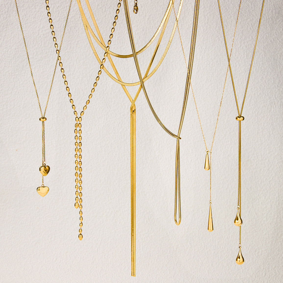 Layered Gold Statement Necklaces Set - Y2K Inspired Dainty Chains with Heart, Teardrop & Geometric Pendants for Trendy Women's Fashion